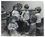Children look at hamster alongside teacher by Indiana State University, University Archives