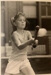 Girl playing baseball/softball by Indiana State University, University Archives