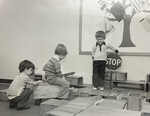 Kids play with blocks and wooden truck by Indiana State University, University Archives